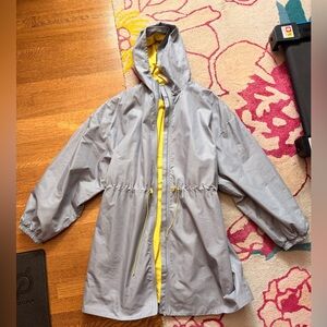 Fabletics women’s Hooded Raincoat in Gray and Yellow